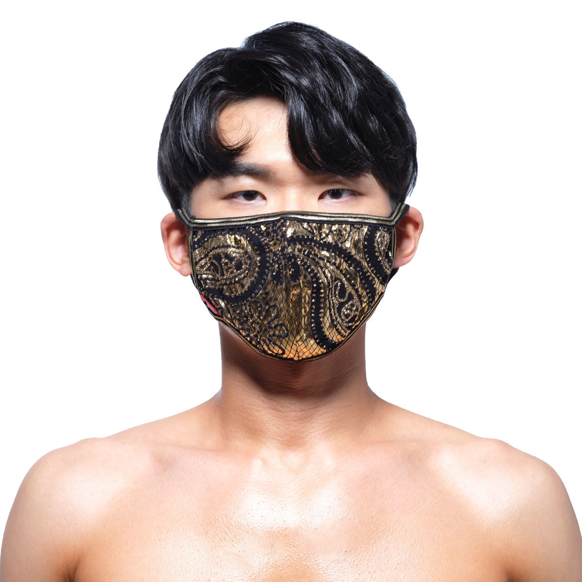 A black and gold sequined face mask with an intricate metal paisley design by MetroMaleWear
