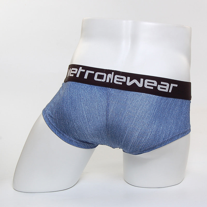 Blue denim textured men’s mini cheek boxer briefs with a black waistband featuring white metrowear branding