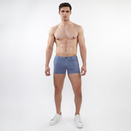 A pair of men’s light blue slim-fit 3 inch stretch knit shorts with five-pocket design and button closure