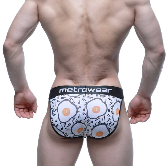 White men’s briefs with fried egg pattern and black trim featuring metrcwear brand on waistband metroMaleWear Sunny Side Bikini 3004-55