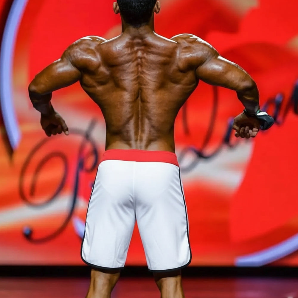 White metromusclewear mens physique board shorts with red waistband and black trim for ifbb pro metromailewear
