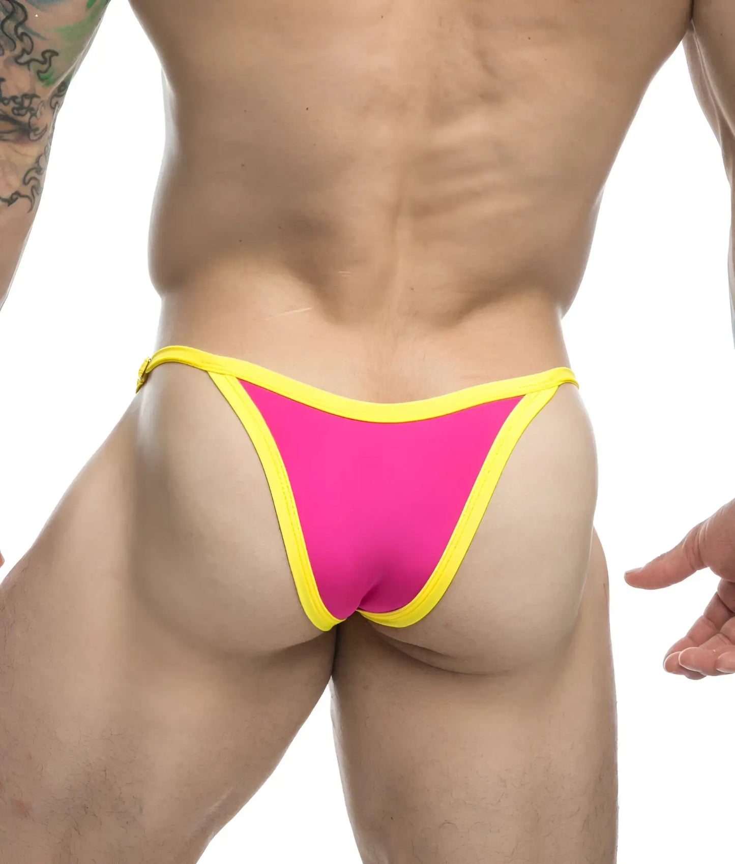 Vibrant pink and yellow thong from justin + simon bikini one with a snug, form-fitting design shown from the back