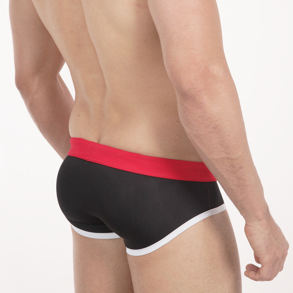 Black briefs metroMalewear pride swim brief with bold red waistband and white trim along leg openings