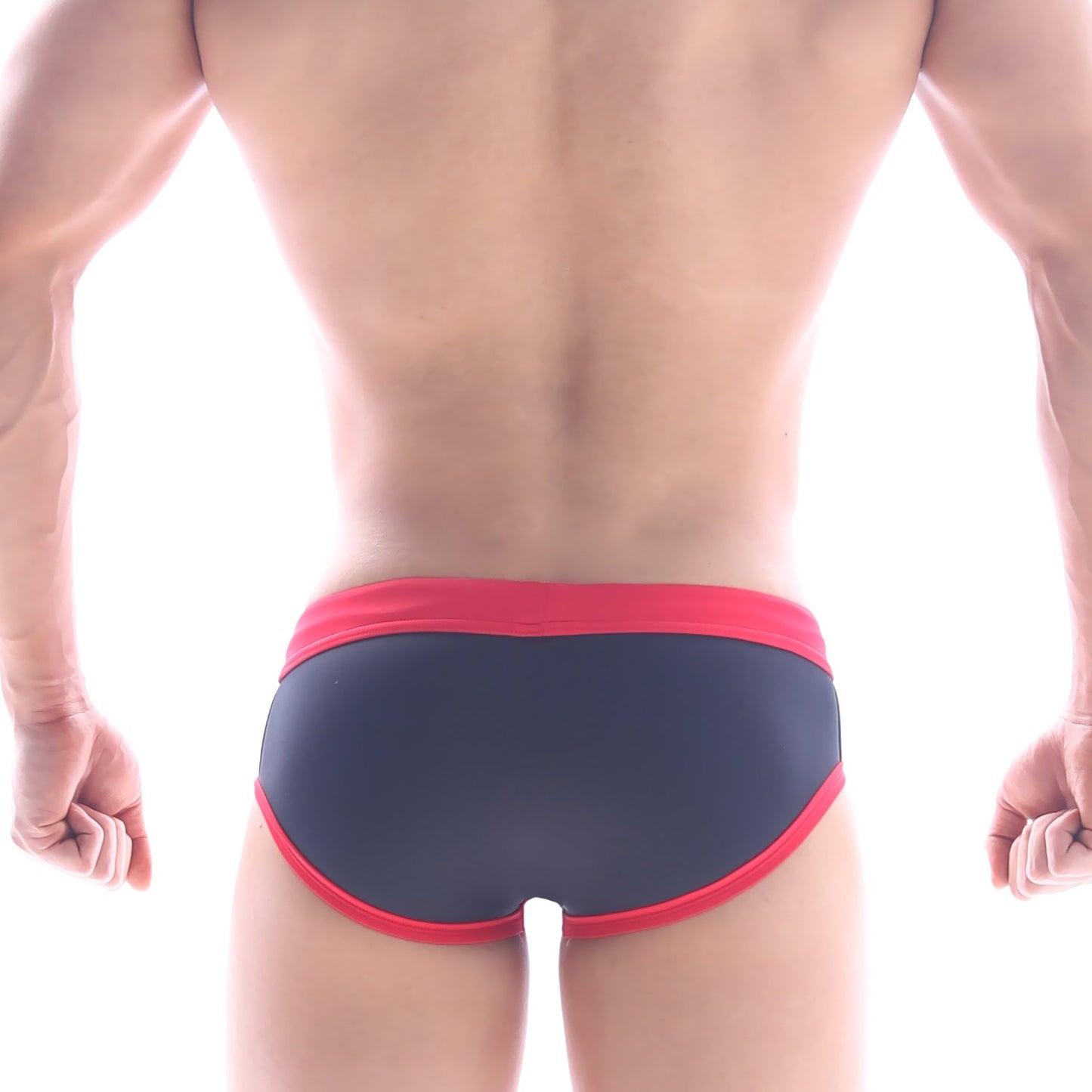 Dark blue metro male wear frame swim brief with bold red trim on waistband and leg openings for swimming