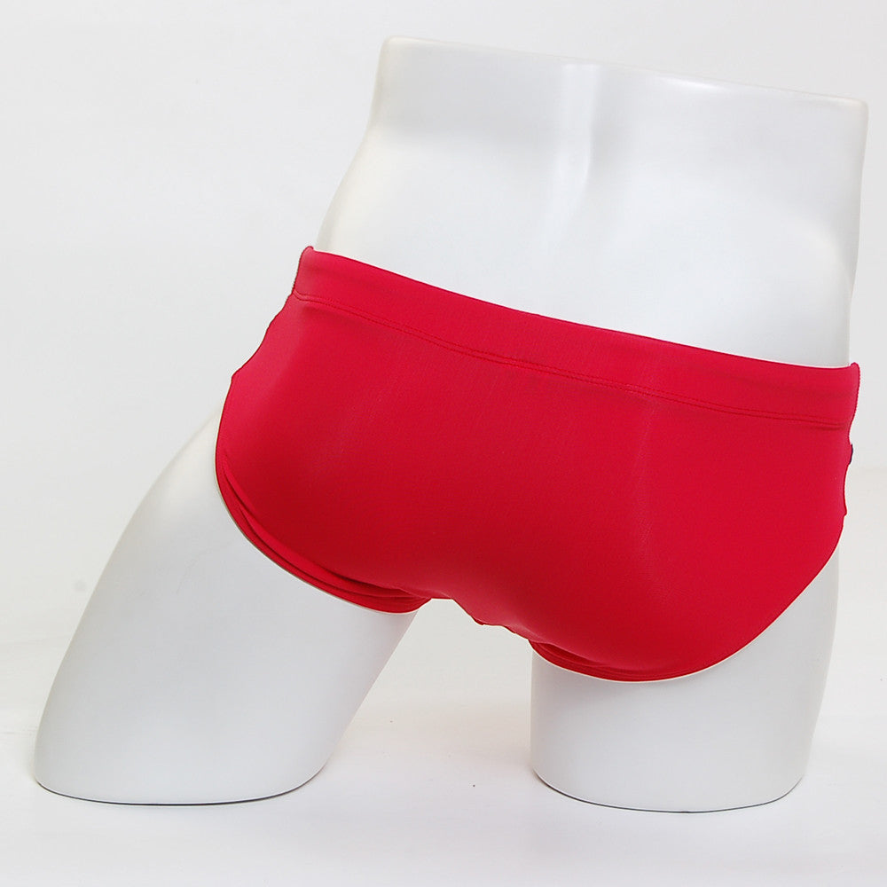 Bright red MetroMaleWear Ibiza swim brief 4928-12 swim trunks displayed on a mannequin side view