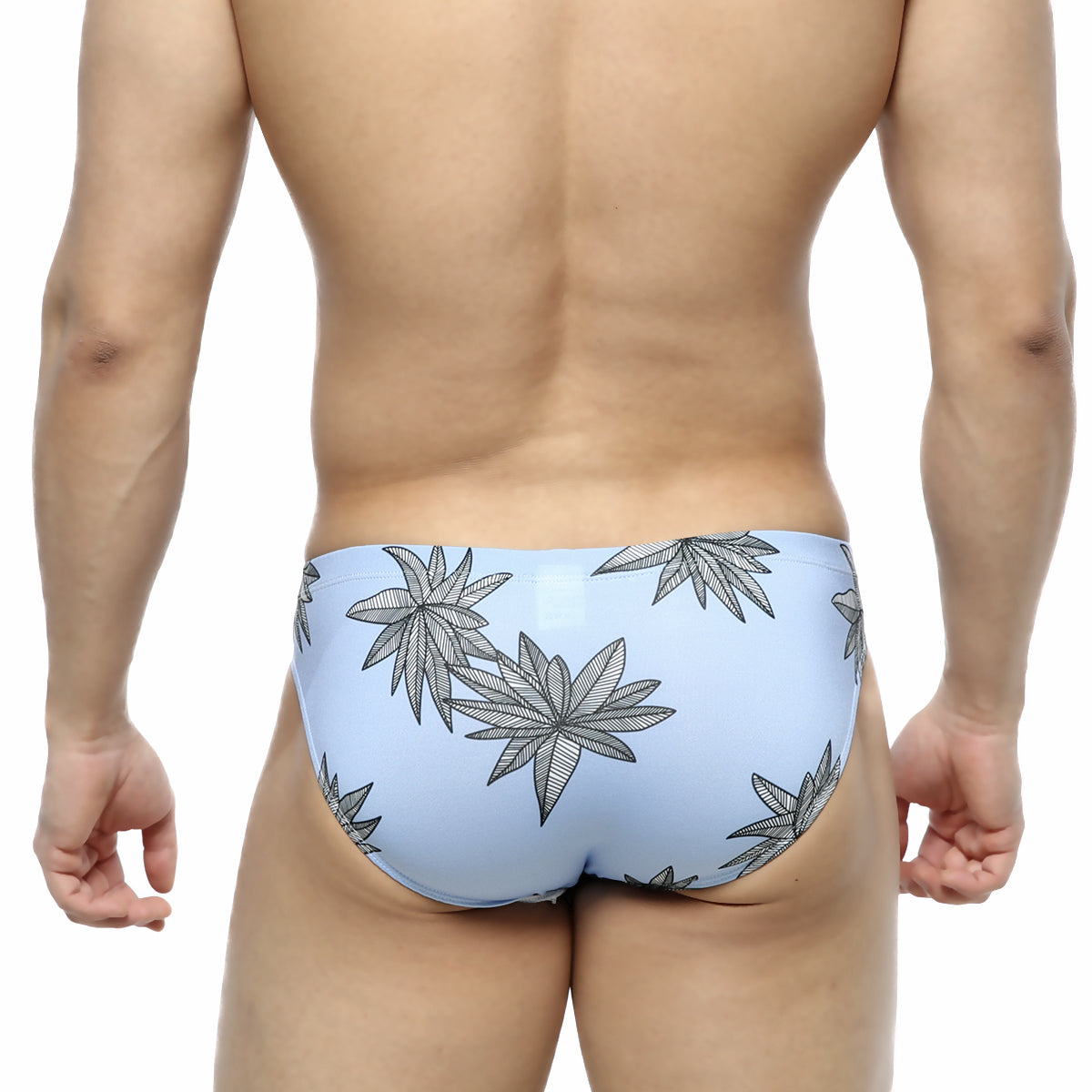 Light blue MetroMaleWear Palma Bikini 5103-49 swim trunks with bold black leaf pattern for beachwear
