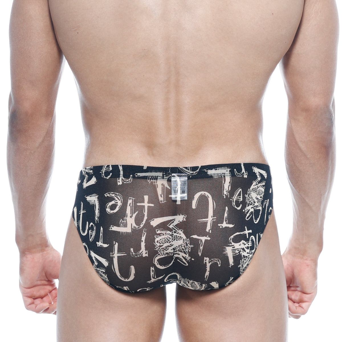 Black sheer swim trunks with bold white abstract graffiti pattern from metromalewear vaso hip brief oraculo 5103-78