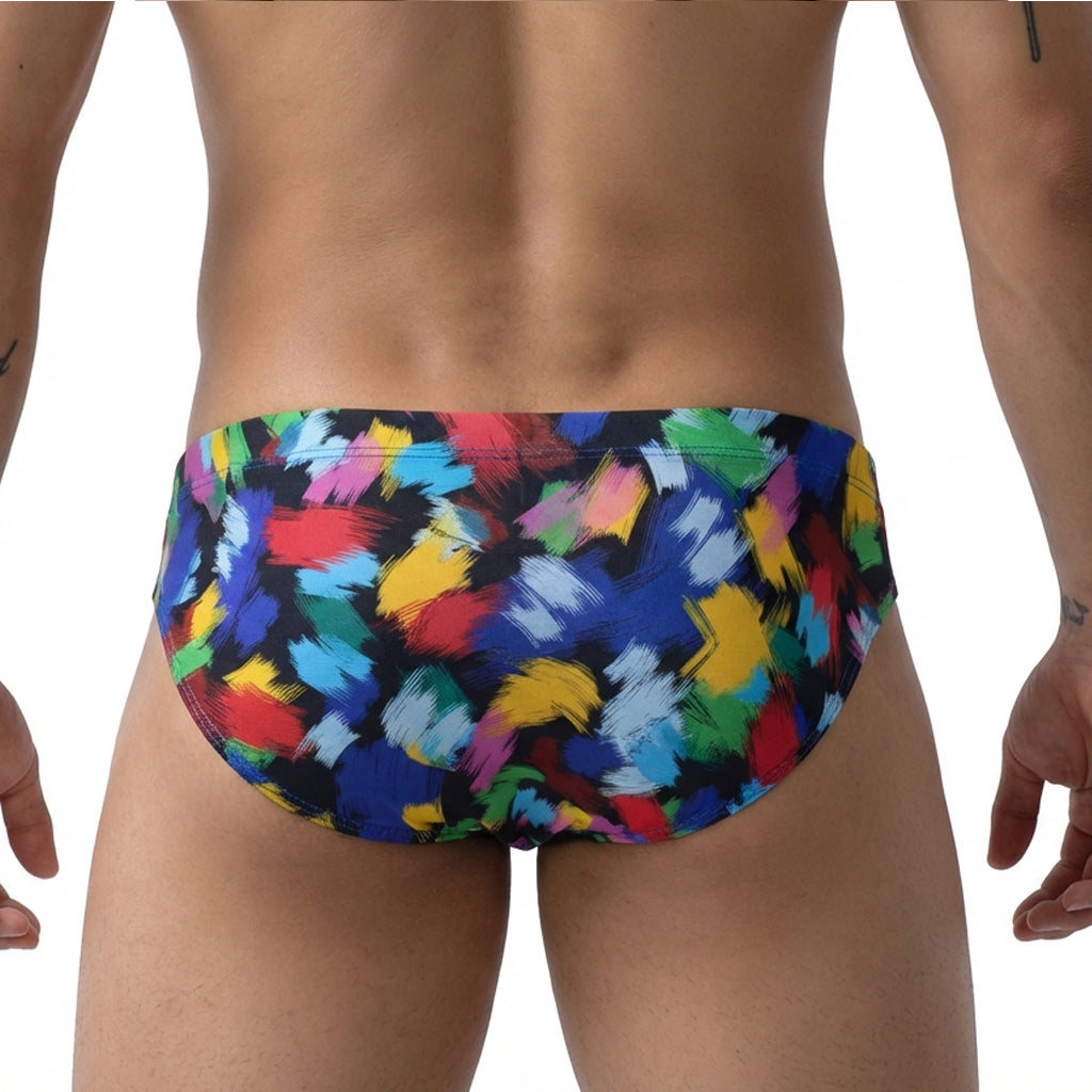 MetroMalewear primavera bikini 5103-M84 swim trunks with vibrant abstract brushstroke pattern in red blue yellow green on black