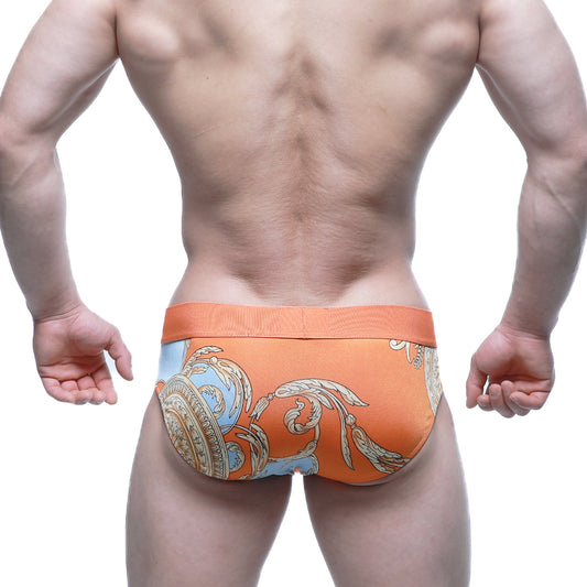 Orange men’s briefs with blue and gold ornate pattern by metro malewear model narangja brief 5203-24
