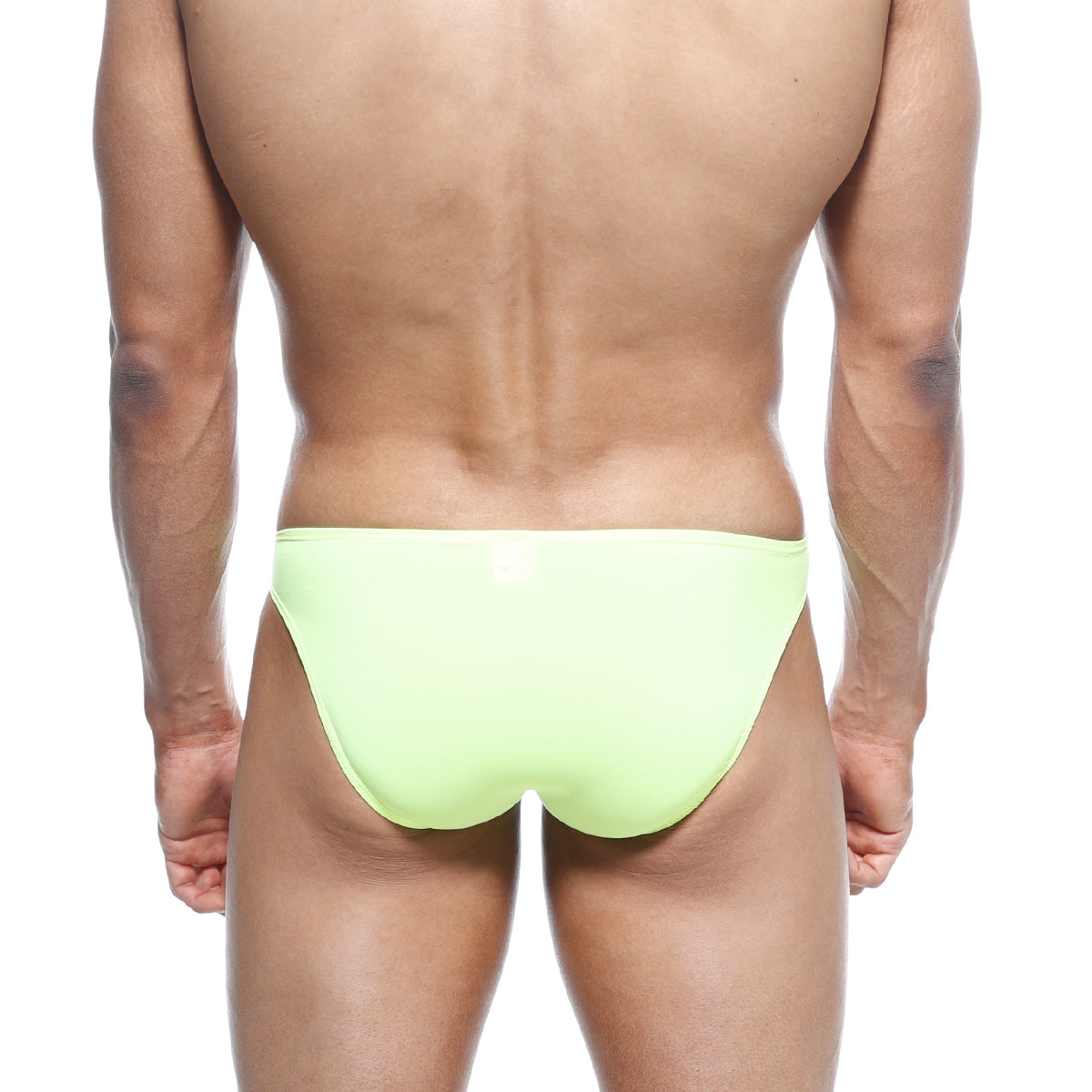 A sleek neon lime metroMalewear max bulge bikini swimsuit with smooth form-fitting design in bright green