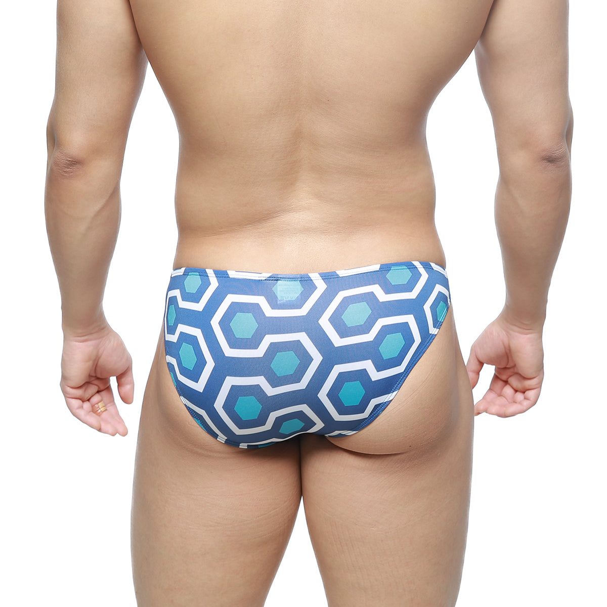 Blue and white geometric-patterned swim trunks with retro hexagonal design from MetroMaleWear super lowrise bikini line