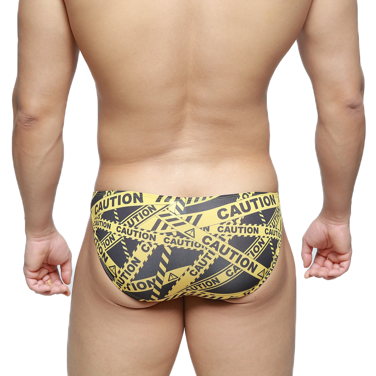 MetroMaleWear caution lowrise bikini swim trunks in black with yellow and black caution tape pattern front view