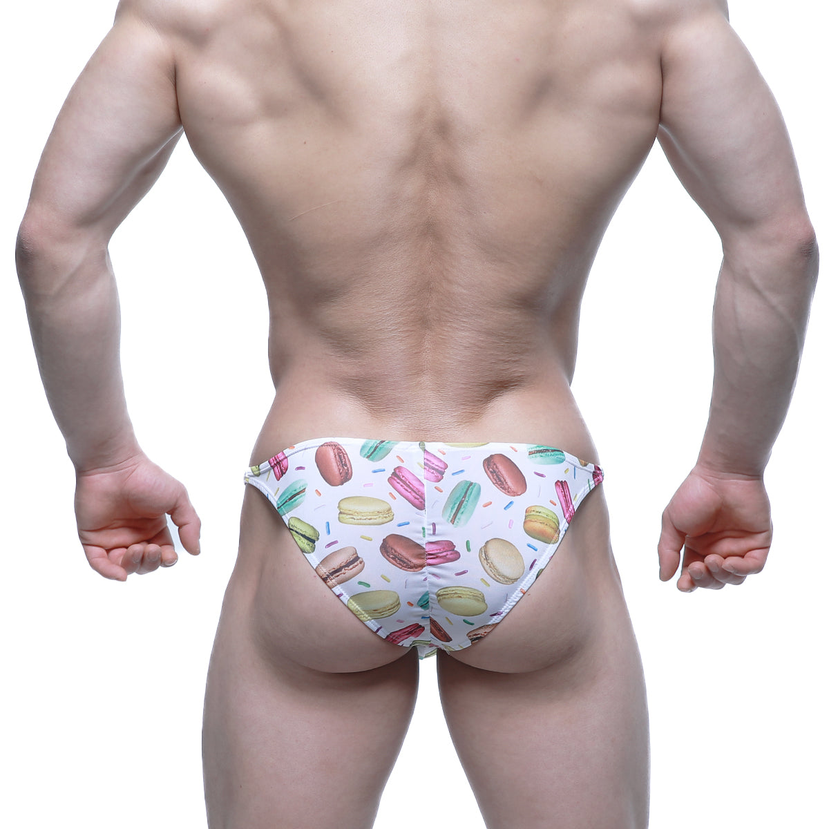 White swim trunks by MetroMaleWear featuring a colorful macaron and sprinkle pattern for playful beachwear