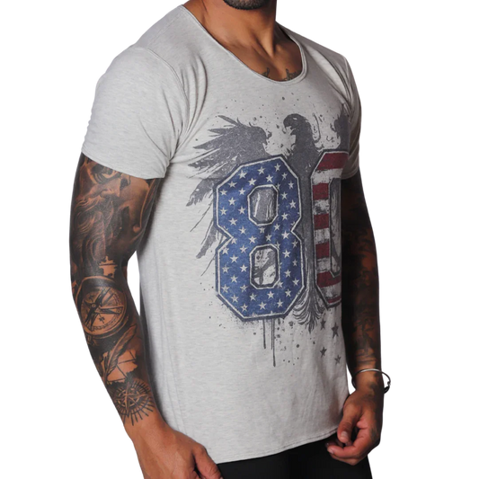 Light grey, raw-edge scoop neck t-shirt featuring a distressed eagle graphic with US flag-patterned "80" text.