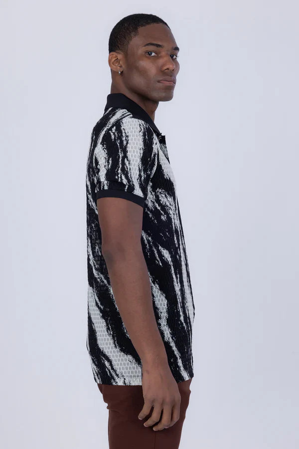 Black and white abstract patterned polo shirt with textured knit design perfect for casual wear