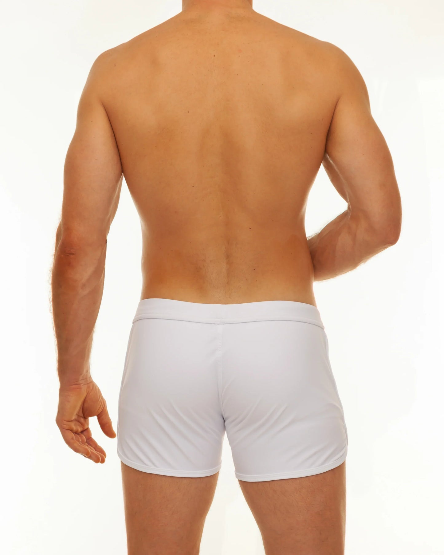 White athletic briefs with a smooth form fitting design featured in the along slit swim short collection