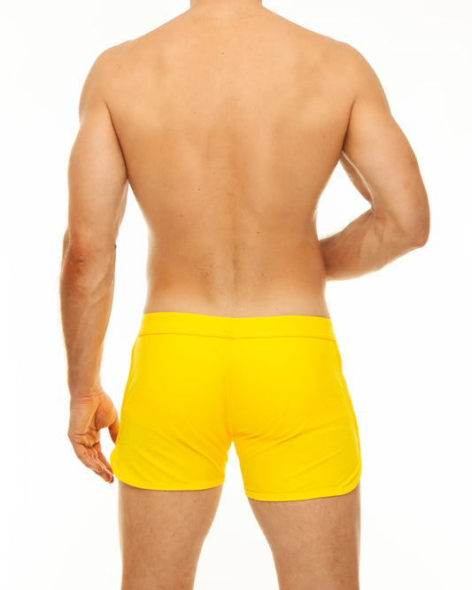 Bright yellow along slit swim short swim trunks with a smooth fitted design perfect for swimming and beachwear