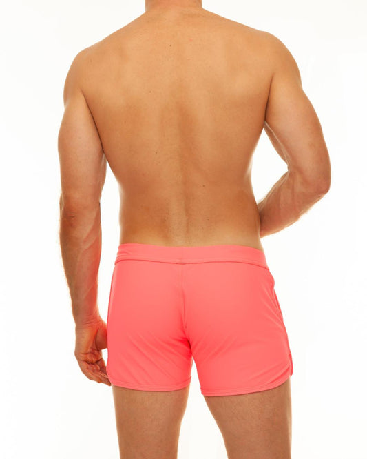 Bright coral along slit swim short made of smooth stretchy fabric with a simple elastic waistband