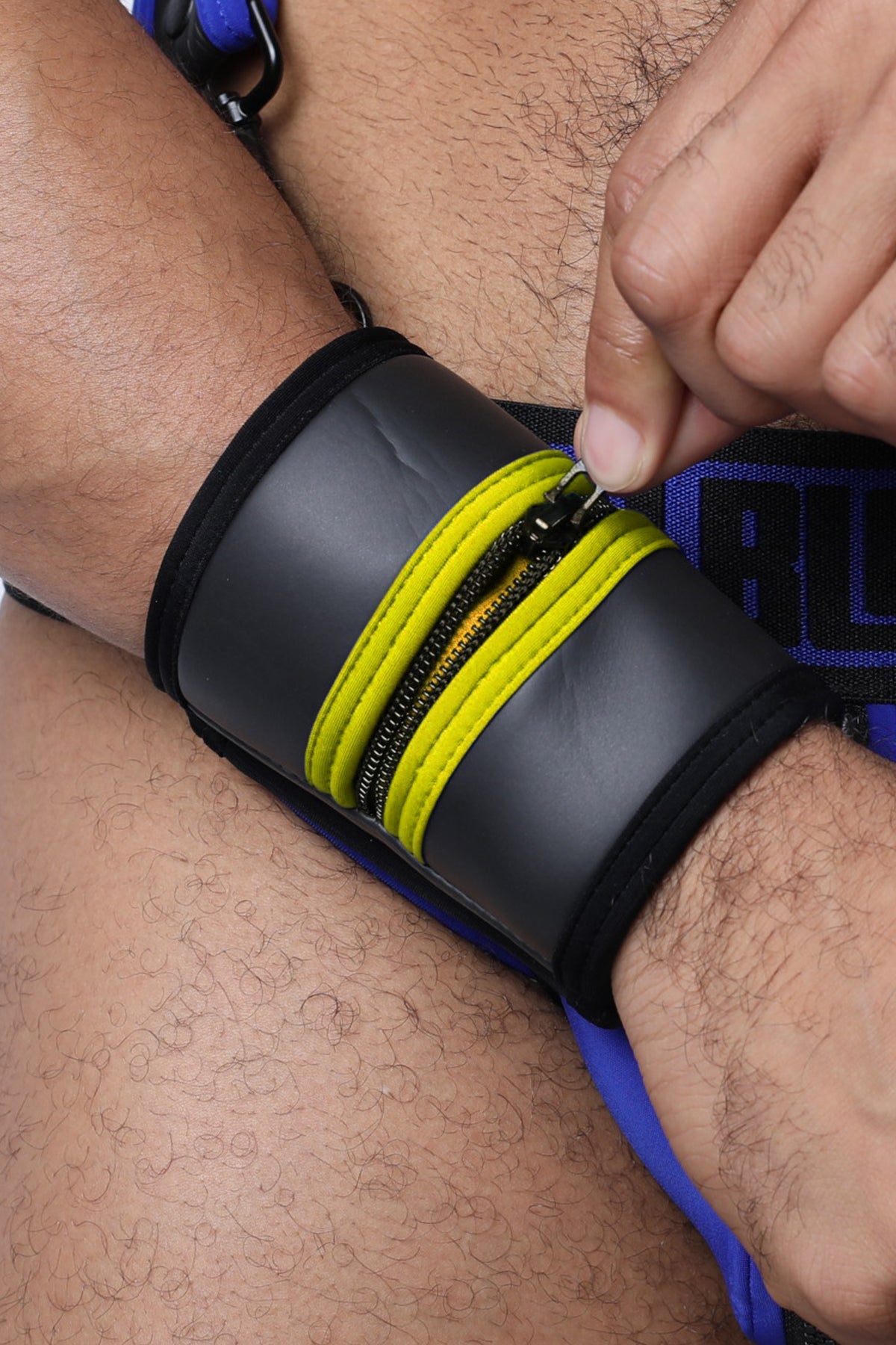 Black buckle up cuff wristband with bright yellow zipper accents available in 5 colors