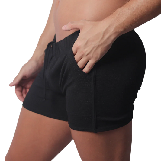 Black knit athletic shorts with an elastic drawstring waistband and side pocket detailing.