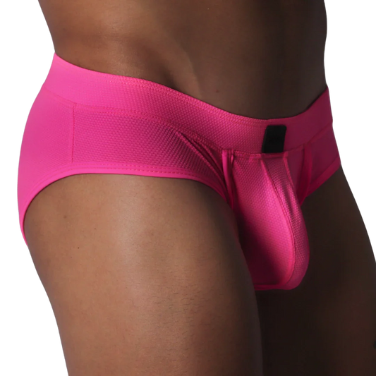Fuchsia brief in textured, honeycomb-patterned fabric featuring a contoured pouch and a small black rectangular logo.
