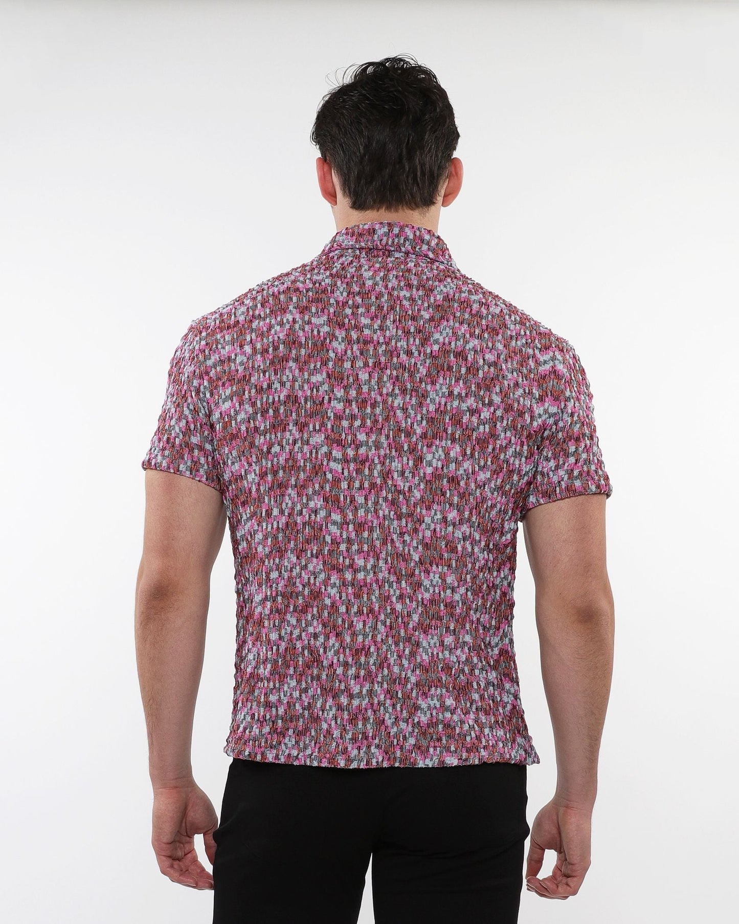 A man wearing a crinkle knit short sleeve shirt in pink gray and white marled texture visible from the front