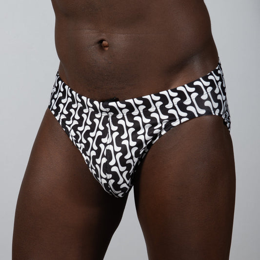 Black and white patterned curves print brief swim trunks with bold abstract wave design for beachwear