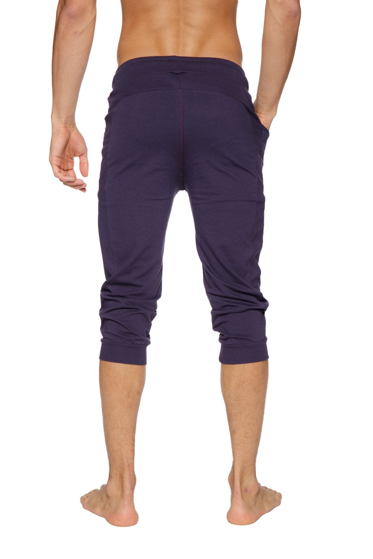 Dark purple cuffed yoga pants with stretchy fabric and elastic waistband for comfortable activewear use