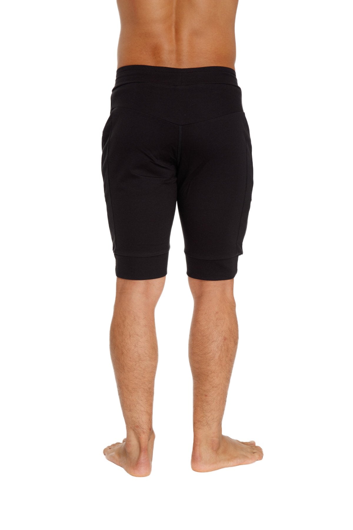 Black cuffed yoga shorts with elastic waistband and ribbed cuffs for comfortable athletic wear