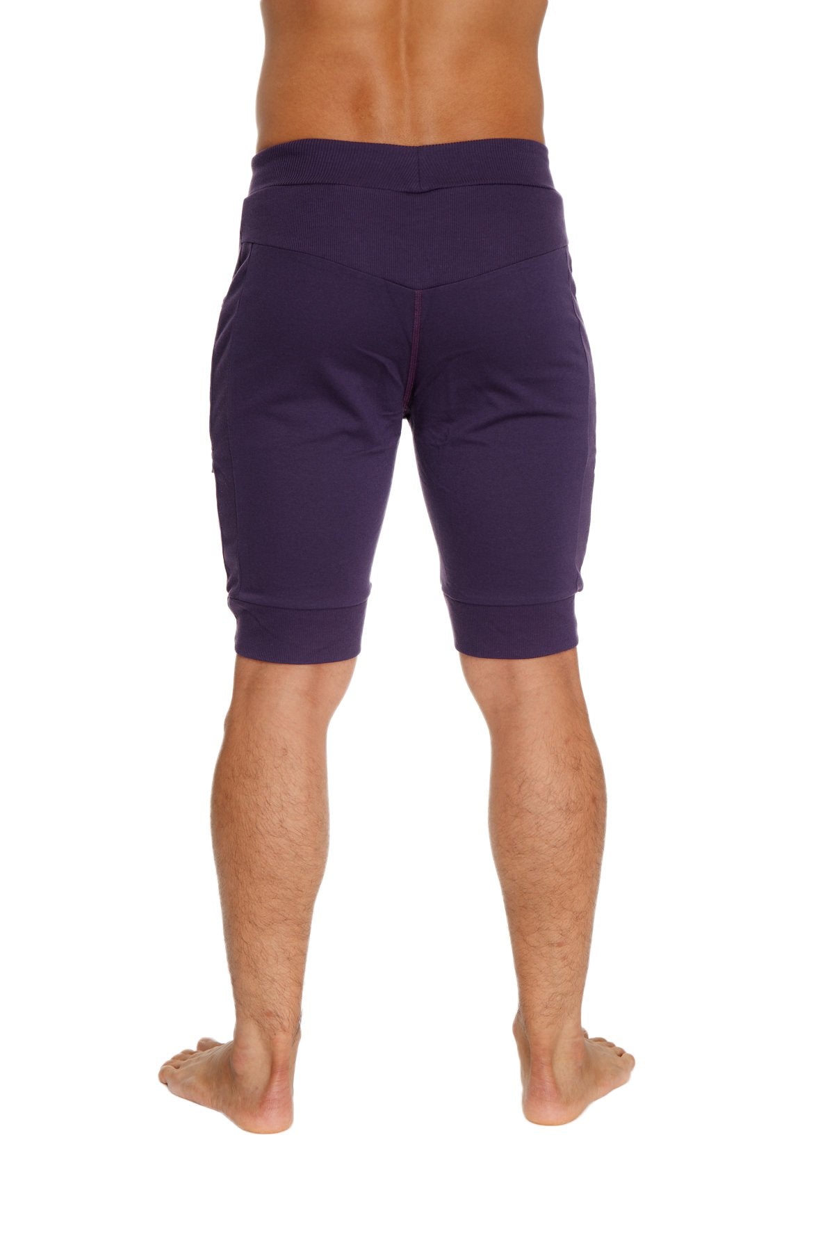 Purple cuffed yoga shorts with elastic waistband and ribbed cuffs designed for comfort and flexibility