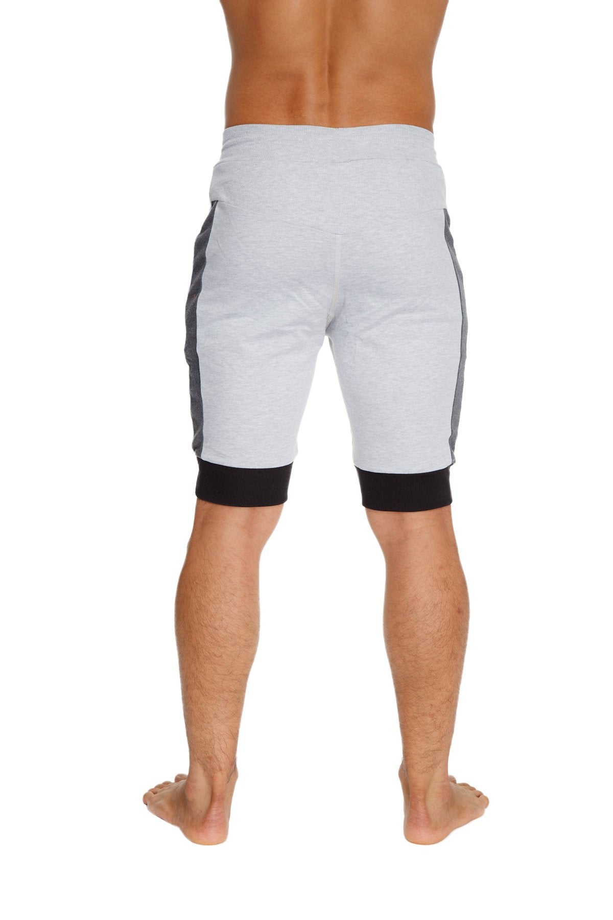 Light gray cuffed yoga shorts with dark gray side panels and black elastic cuffs designed for athletic wear