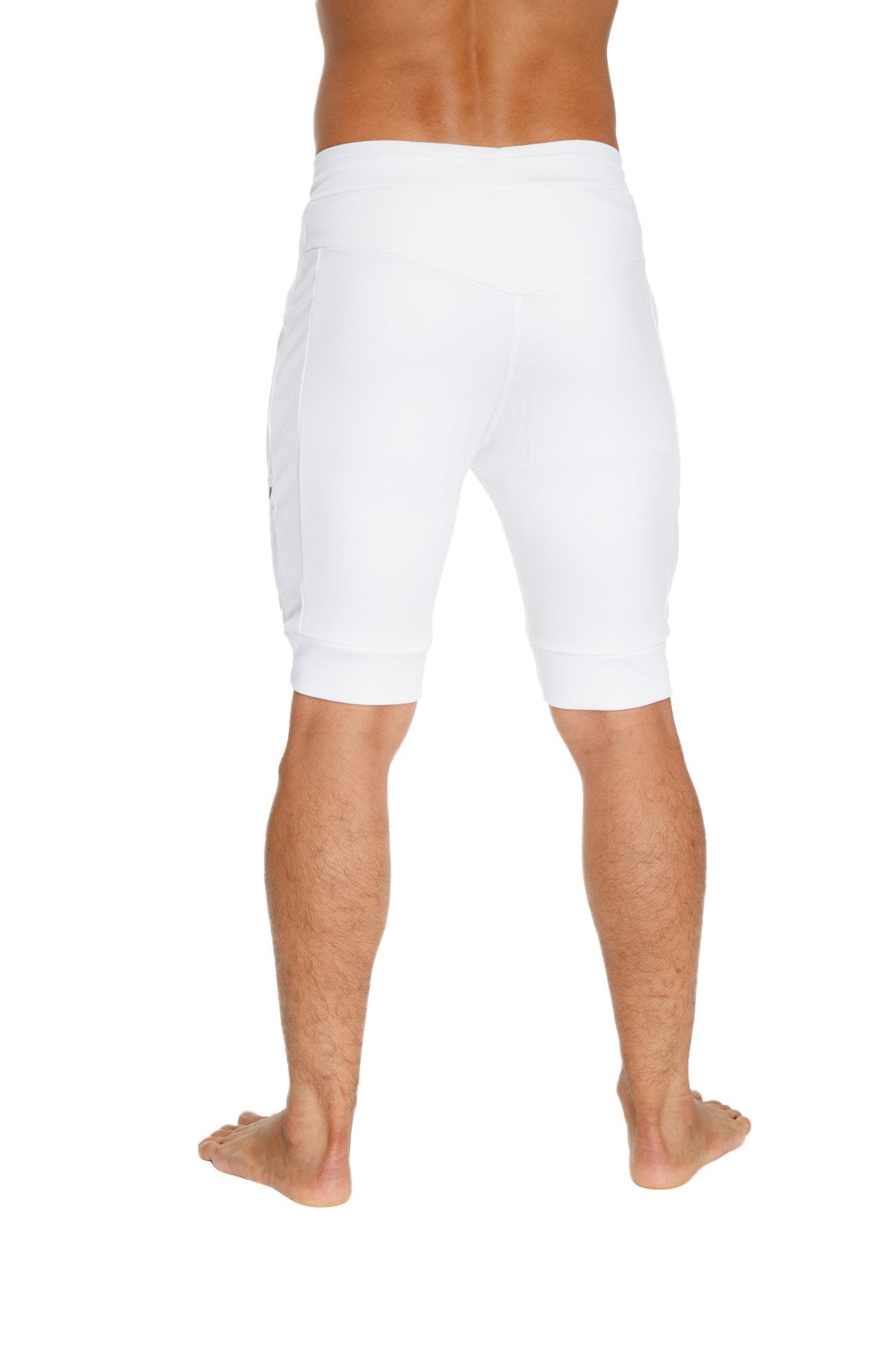 White cuffed yoga shorts with snug fit and side pockets designed for athletic and casual wear