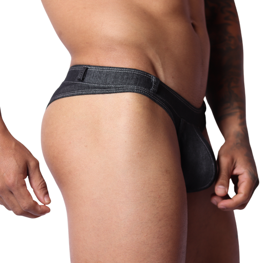 Side view of Gigo black denim G-string underwear with visible stitching and belt loop detail on a male model.