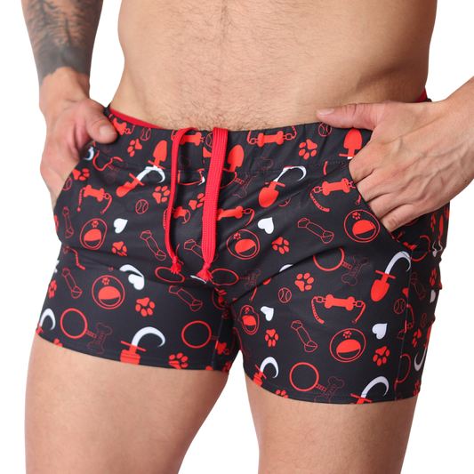 Front view of Gigo red and black dog print fabric shorts with drawstring waist and pockets.