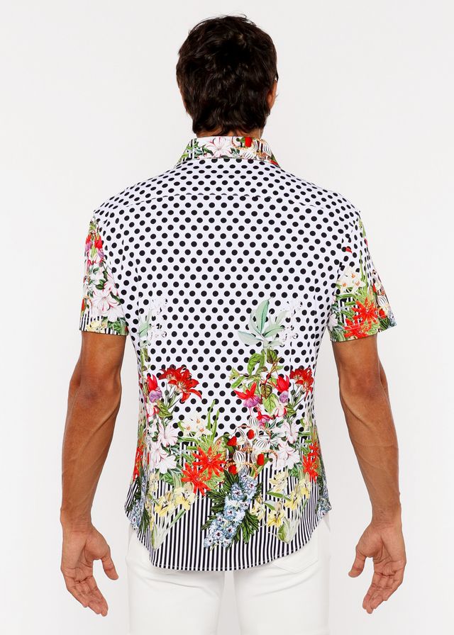 A vibrant short-sleeved men’s woven modal shirt with black and white polka dots and colorful floral border prints