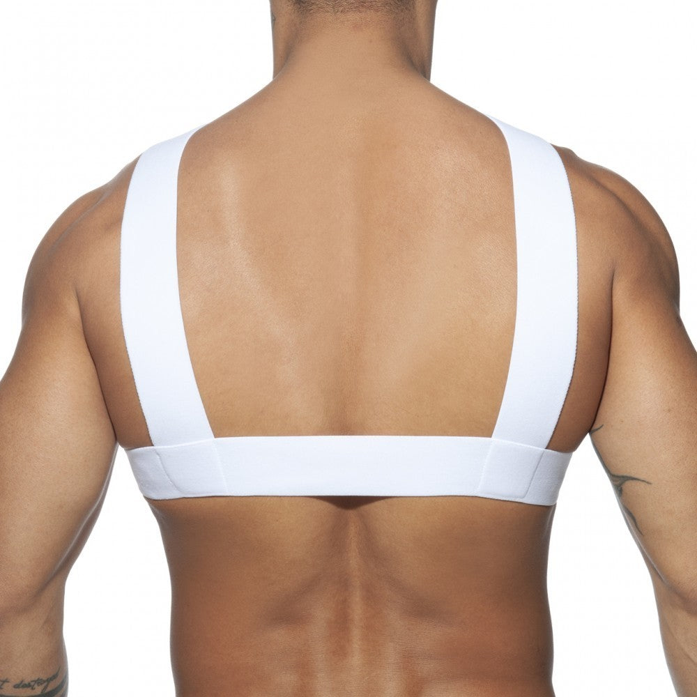 White minimalist sports bra with wide shoulder straps and supportive band featured in double ring harness design