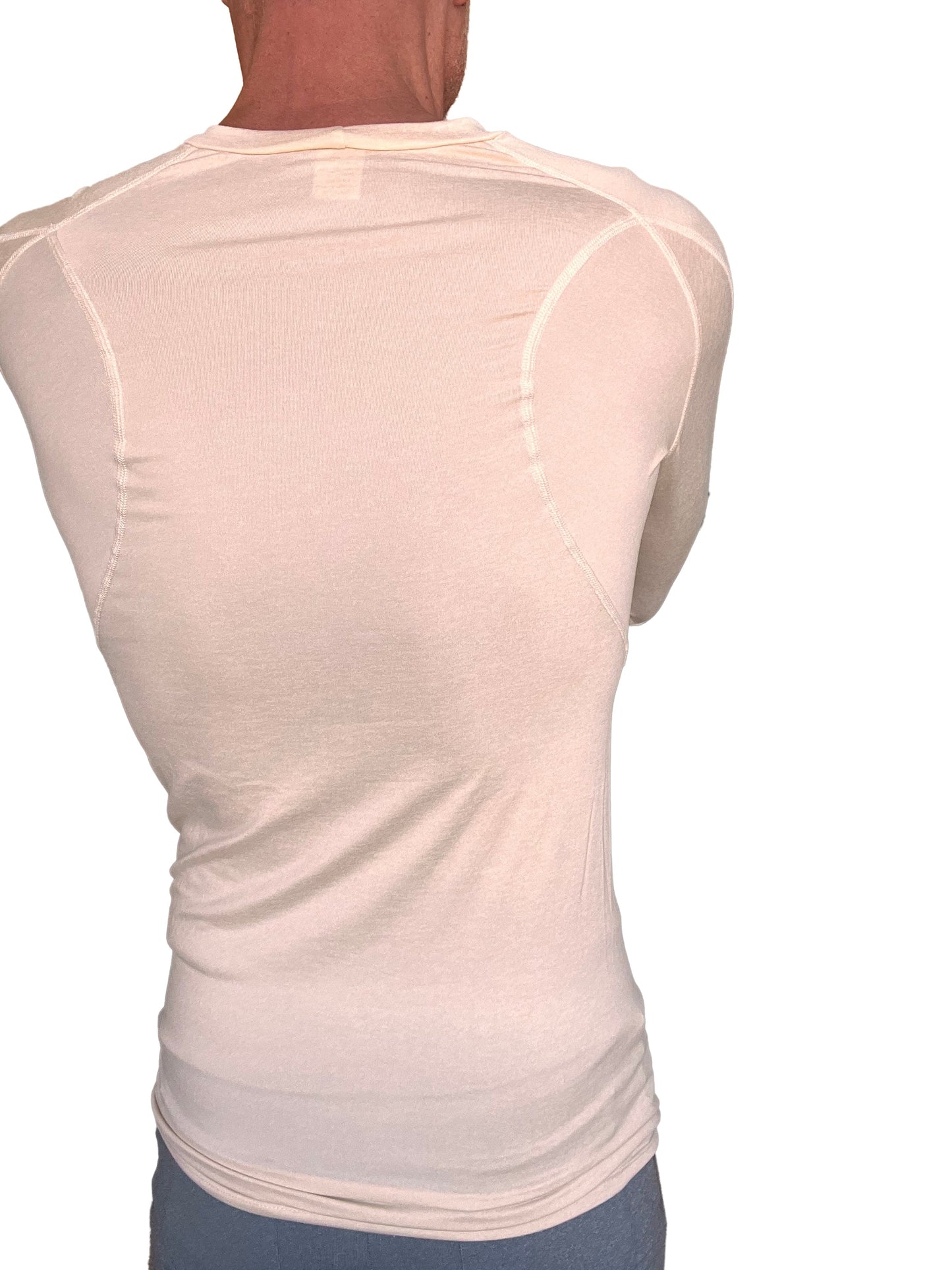 A cream-colored designer raglan crew-neck long sleeve tee with fitted design and subtle seam detailing in sand beige