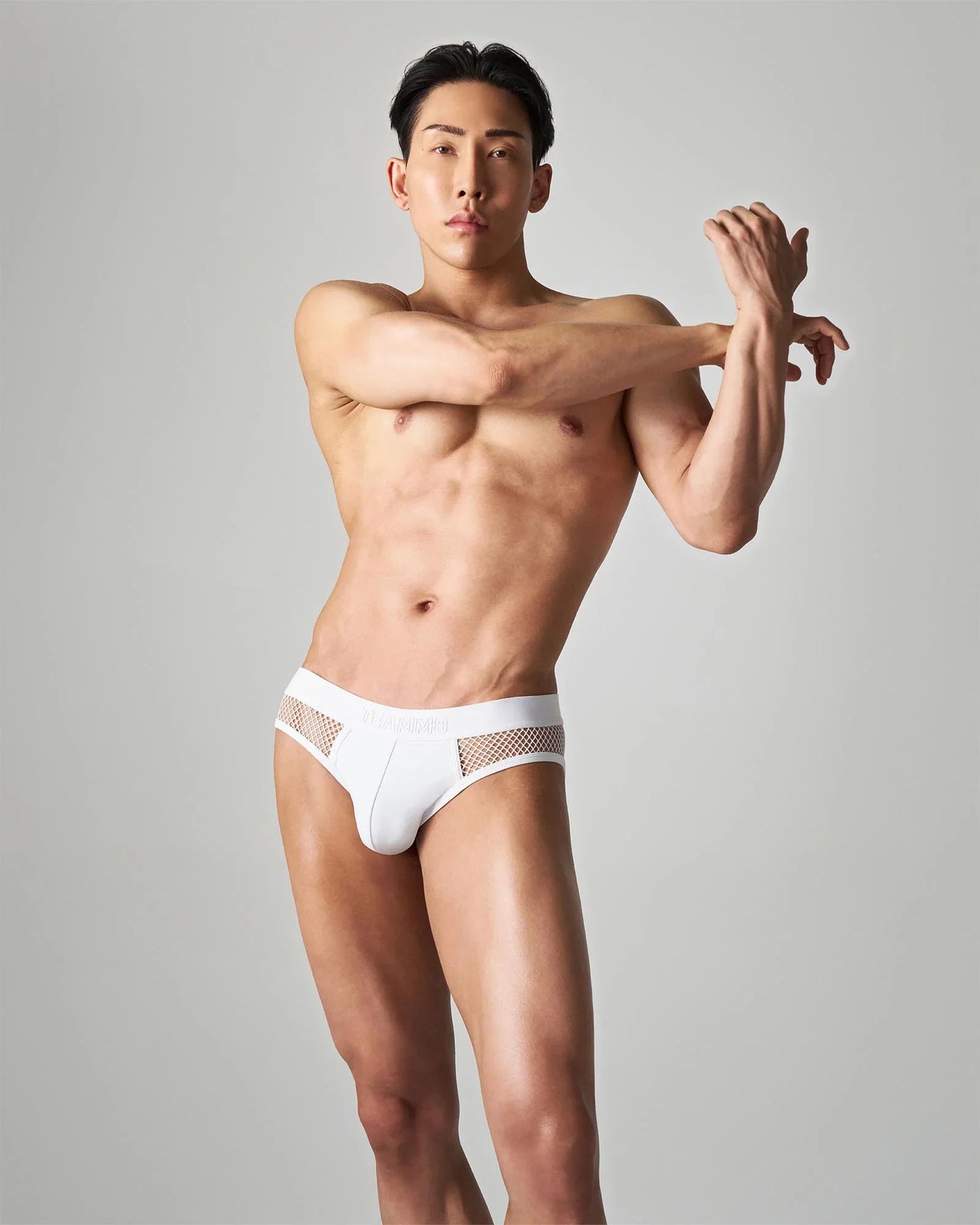 White mesh-trimmed edge net brief with sleek modern design in breathable fabric for comfortable everyday wear
