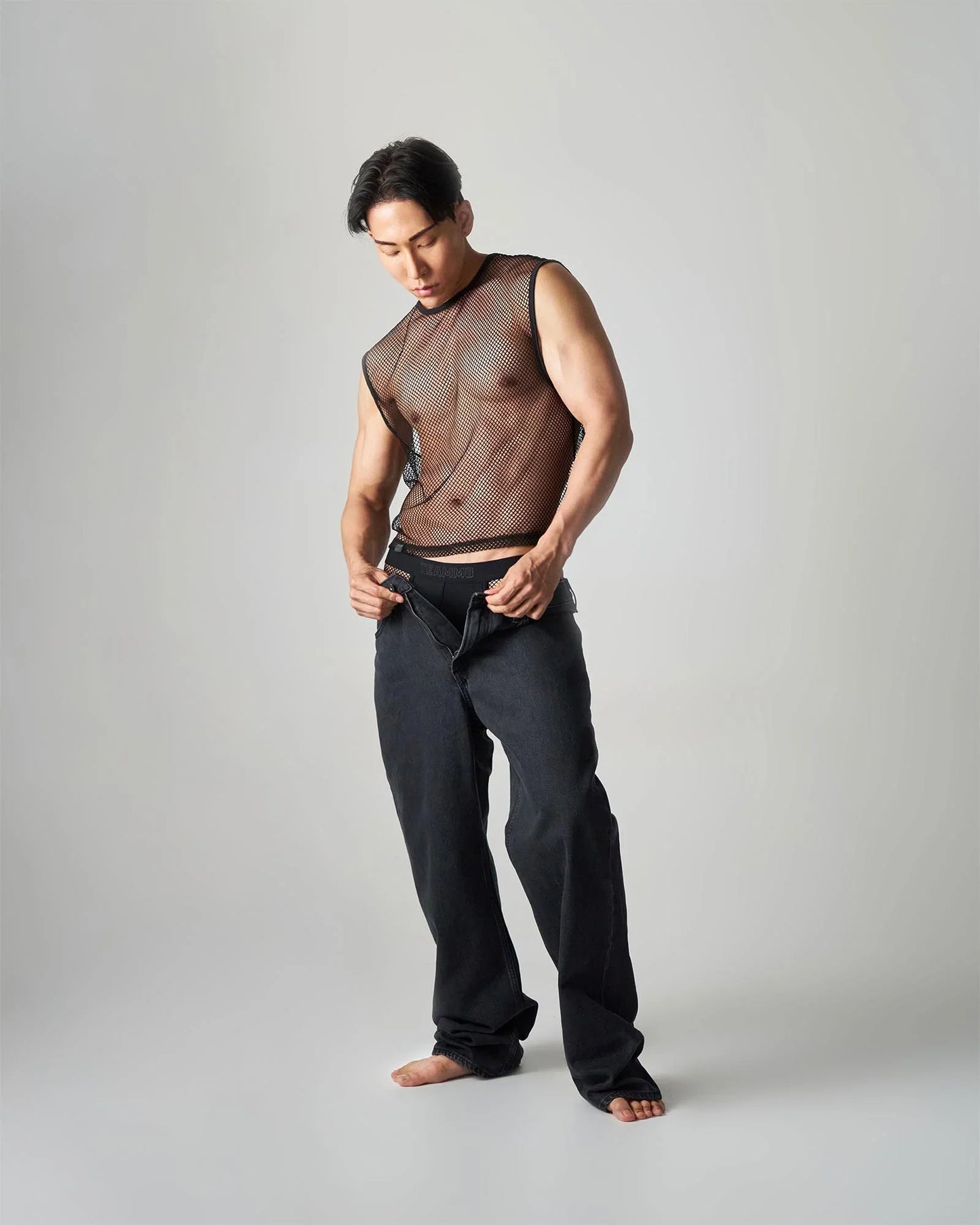 Black edge net mesh muscle tank with sheer semi transparent design made of breathable mesh fabric