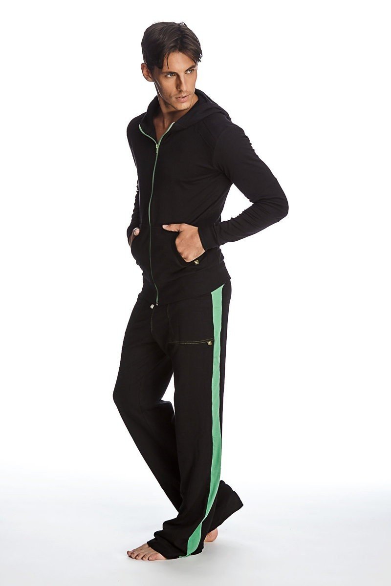 Form-fit crossover yoga track performance hoodie set in black with green zipper and matching pants with green stripe