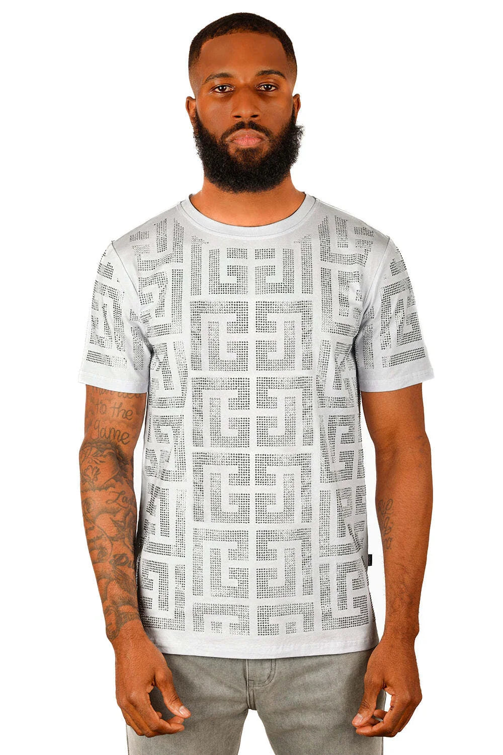 White short-sleeved t-shirt with bold geometric Greek key pattern adorned with sparkling rhinestones