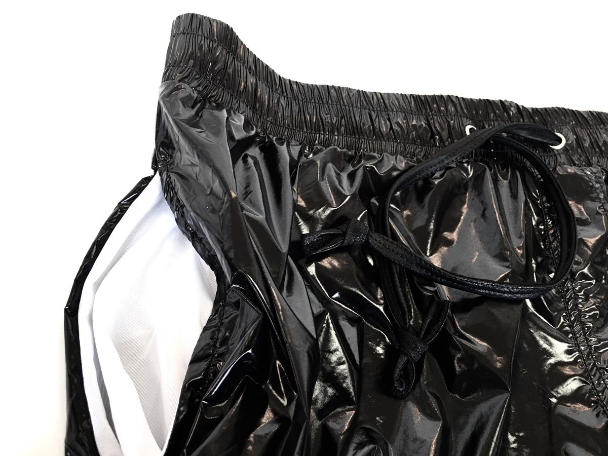 Black glossy nylon high gloss shorts with white inner lining and elastic waistband for comfortable fit