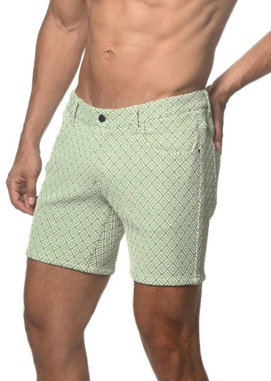 Light green jacquard printed stretch knit shorts with repeating dark green geometric pattern button closure and belt loops
