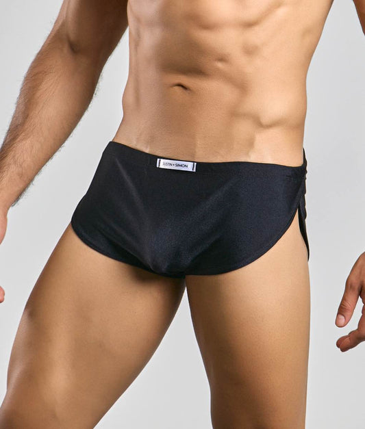 Black Justin + Simon running short athletic briefs with sleek form-fitting design and subtle side slit for performance