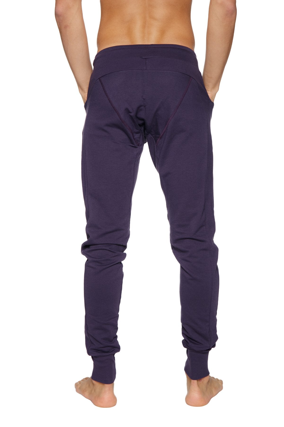 Long cuffed jogger and yoga sweat pants in dark purple soft fabric with elastic cuffs and a relaxed fit