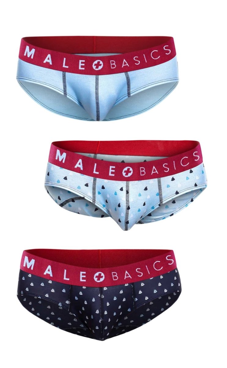 Three pairs of Malebasics briefs with red elastic waistbands featuring solid light blue, triangle, and sailboat patterns