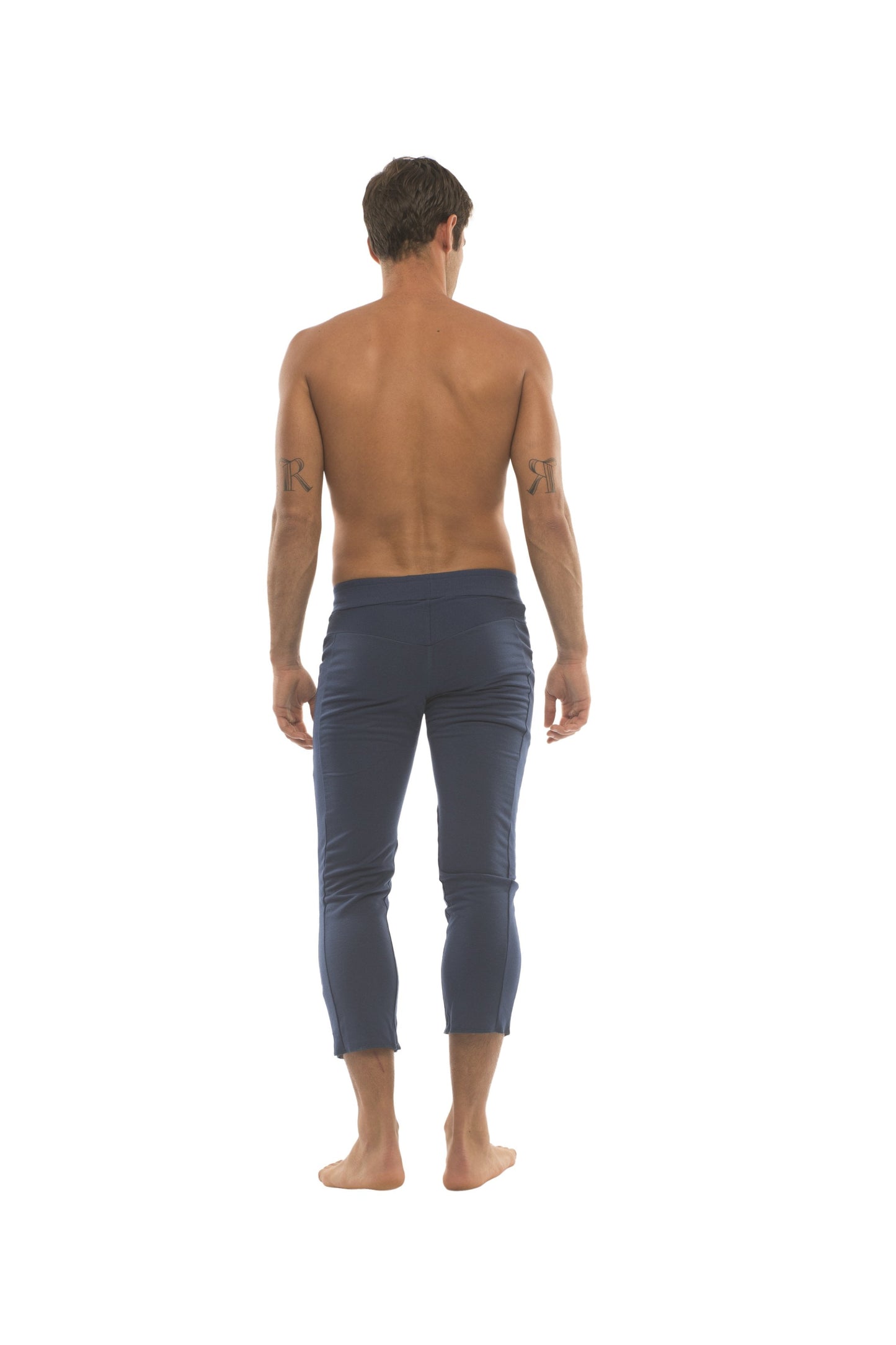 Mens navy blue cropped capri yoga pants with 4 zipper pockets designed for comfort and active use