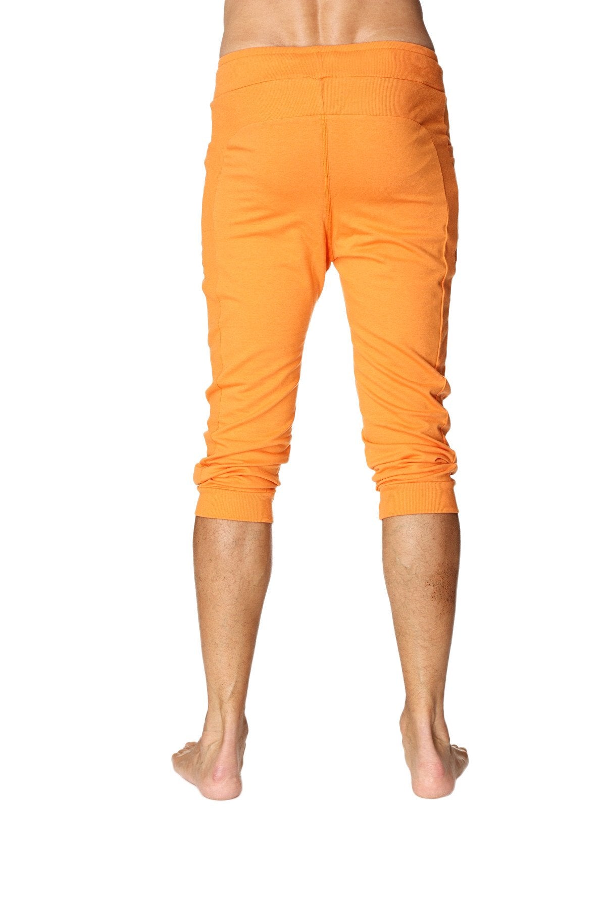 Mens cuffed yoga pants in solid sun orange with relaxed fit and elastic waistband for comfortable wear