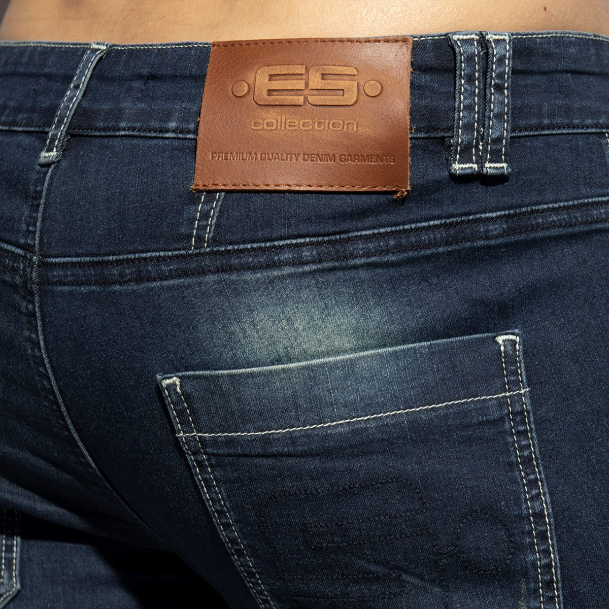 Dark blue denim bermuda jeans with brown leather es collection patch on the back waistband