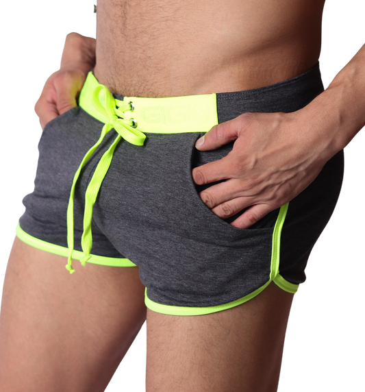 Side view of Gigo Nafts gray jersey shorts with neon yellow trim, lace-up waistband, and drawstring.